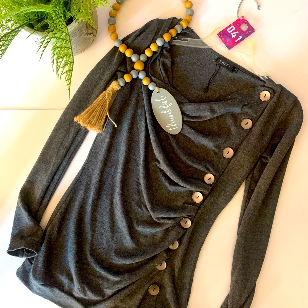 Must see and must have. Jean sweater here. Cute sweater in sz. SM gray. New.